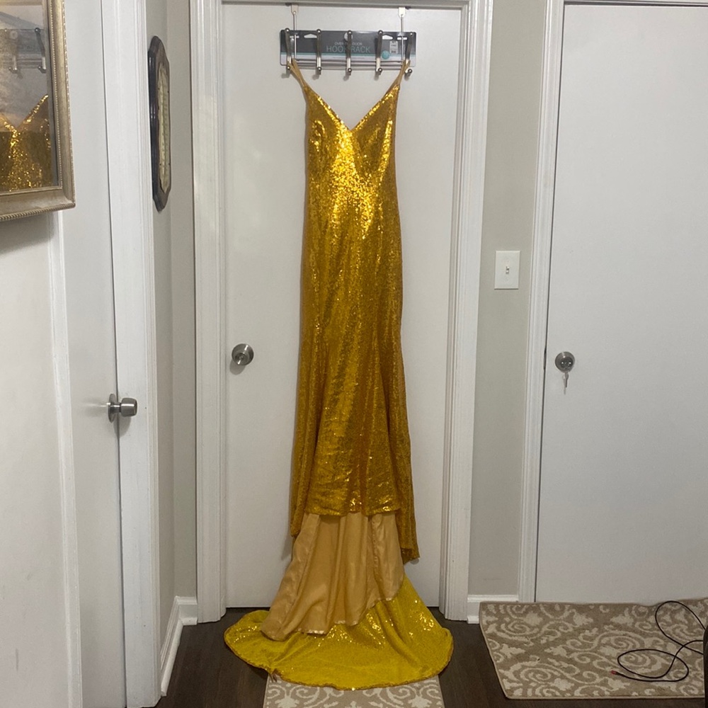 Gold Pre-Love adjustable strap gown with trail. excellent condition.Size S very.